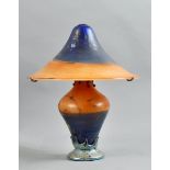 A French Pascal Gouet iridescent art glass lamp and shade, orange and blue clouded decoration with