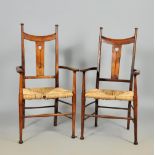 A pair of William Birch style Arts & Craft open armchairs with dipped top rails and stylistic floral