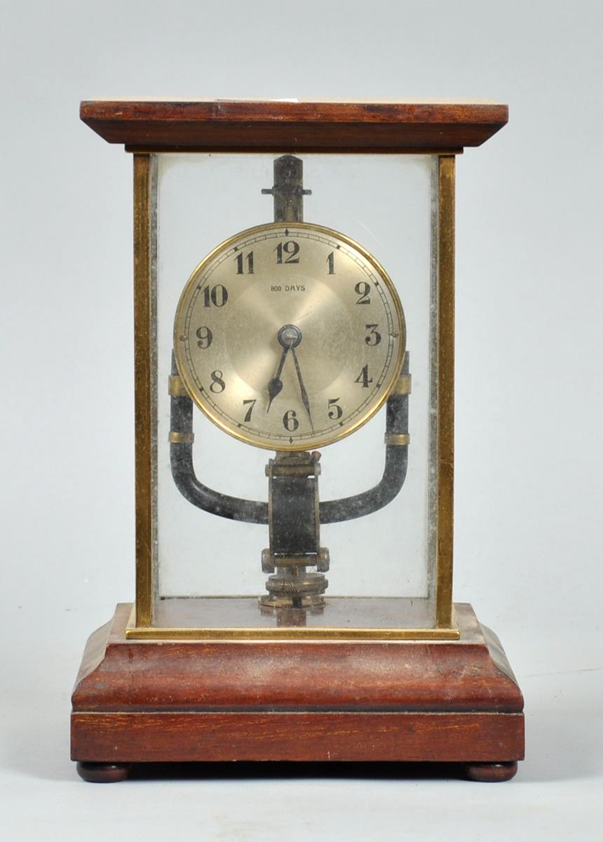 A 1920's Bulle electric clock, the mechanism with coil pendulum encircling a magnetic electrode