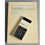 A 1970's Cambridge Programmable calculator with program library volumes 1-4.