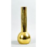 An early 20c gilt brass vase with a bulbous beaten body and long cylindrical neck with stylistic