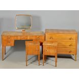 A Gordon Russell part bedroom suite comprising a dressing table 48"w, two bedside cupboards 15"w,