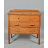 A 1930's oak chest of three long drawers supported on straight square legs, 38"w, 38"h.