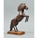 A carved wood figure of a rearing horse , the rectangular chamfered base carved 'St Lawrence