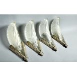 A set of four French Art Deco wall lights with silvered metal brackets and moulded frosted feathered