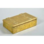 A 1920's brass cigarette box of rectangular form, random textured and with cut and shaped strap