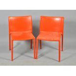 A set of ten Italian Jasper Morrison designed orange stacking air chairs.