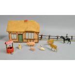 A collection of Britains cold painted farm animals, figures and implements including cattle, pigs,