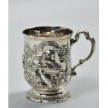 A mid Victorian christening tankard, embossed and chased with a dog on a cushion and a parrot on a