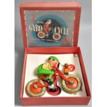 A Triang Giro-cycle complete with original box, bicycle red, cyclist green.