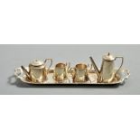 A contemporary silver miniature tea tray together with a piece tea and coffee set, the tray 5.75"l.