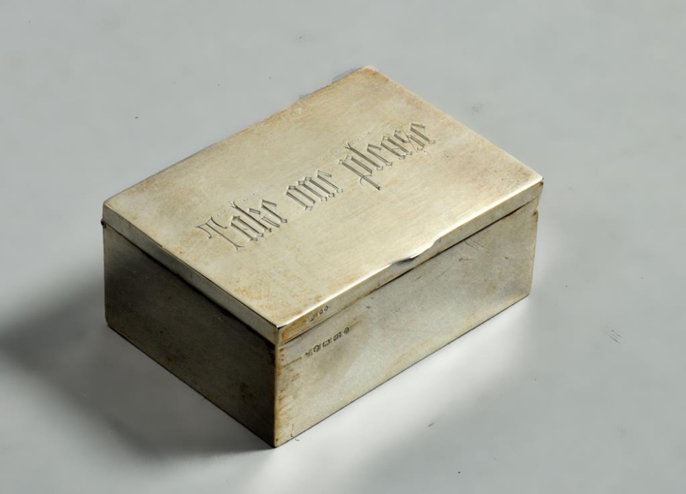 A late Victorian cigarette box , gilt lined, the hinged cover incised 'Take one please',