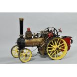 A 20c model of a 19c steam driven traction engine, 23"l, the stack 15"h.