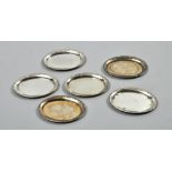 A set of six small Continental silver pin dishes of oval form with raised borders, 2.5"l.