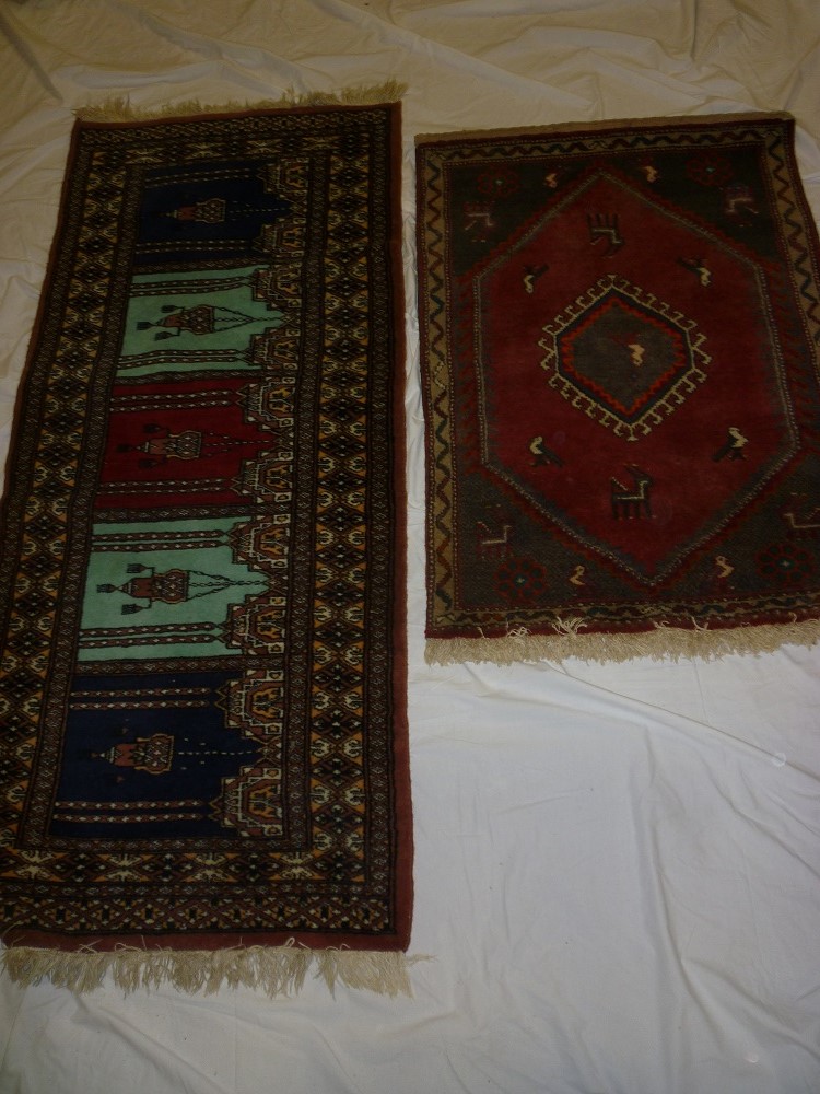 Two small Eastern hand knotted wool rugs with geometric decoration