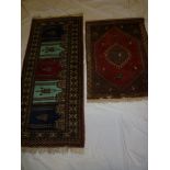 Two small Eastern hand knotted wool rugs with geometric decoration