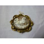 A large Victorian oval cameo mourning brooch, the central panel decorated with a winged figure in