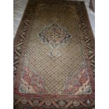 A good quality Eastern-style wool rug with geometric decoration on red and cream ground 98" x 58"