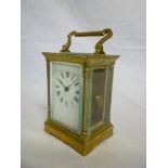 A French carriage clock with rectangular enamelled dial in brass traditional glazed case