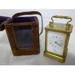 A good quality alarm French carriage clock with enamelled rectangular dial in a brass traditional-