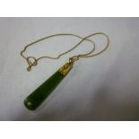 A good quality jade tapered pendant with 15ct gold rope twist chain