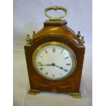 An Edwardian bracket-style mantel clock with circular enamelled dial in inlaid mahogany arched