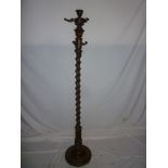 An ornate old carved walnut hat and coat stand with carved spiral turned column and circular base