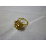 An 18ct gold dress ring set diamond cluster