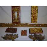 A selection of Chinese carved wood figures and ornamentation including a pair of gilt decorated fish