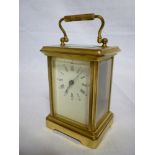 A French carriage clock with rectangular enamelled dial in brass glazed traditional case