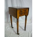 A Victorian figured mahogany rectangular drop leaf work table with two drawers in one end on