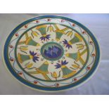 A large Poole pottery circular charger with bell and floral decoration 14" diameter