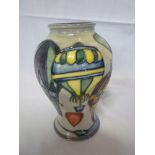 A Moorcroft pottery baluster shaped vase with balloon decoration on grey ground, 6" high, boxed