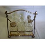 A good quality electroplated six bottle cruet with matching glass bottles and entwined stand