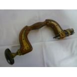 An old beechwood and brass mounted carpenter's brace with lignum vitae handle