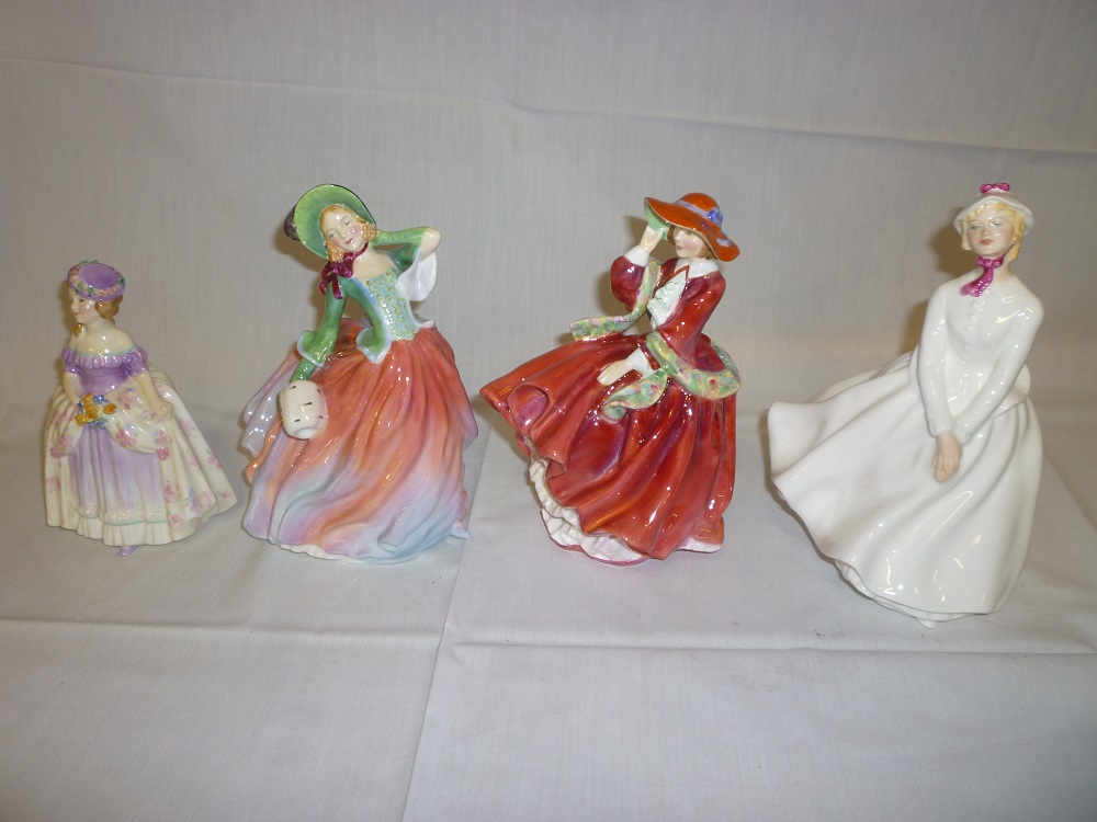 Four Royal Doulton china female figures including "Dainty May" HN1656; "Top O' The Hill", "Autumn
