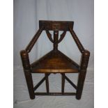 An elm and beech Welsh Turners-style occasional chair with triangular seat and bobbin turned