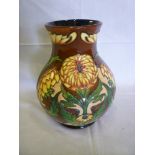A Moorcroft pottery tapered vase with dahlia decoration by Philip Gibson No. 53/250, 9" high, boxed