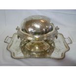 A quality electroplated domed food warmer with engraved scroll decoration on scroll shaped legs