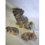 A large Royal Copenhagen china figure of a seated Dachshund dog No. 856 together with three