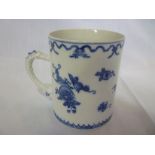 A late 18th/early 19th century Chinese cylindrical tankard with blue and white floral decoration and