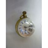 An old Goliath-style desk clock with  bulbous glass front and back and brass mounts