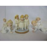 Three old German porcelain figures of children playing