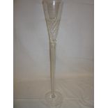 A large glass toasting goblet/ornamental vase with tapered bowl and air twist stem on circular