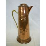 An Art Nouveau copper tapered water jug with hinged lid and brass angular handle