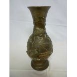 A 19th century Japanese bronze baluster-shaped vase decorated in relief with quail and leaves, 12"