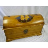 An unusual painted cedar domed top trunk with carved and painted sailing ship design