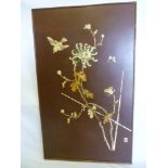 A Japanese rectangular lacquered panel inlaid with bone relief designs of flowers, bird and