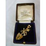 An ornate 9ct gold South African mining brooch, possibly of Cornish mining interest in the form of a