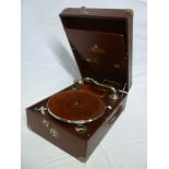 A good quality Decca "Salon" 75 table top portable gramophone with chromium plated mounts in red
